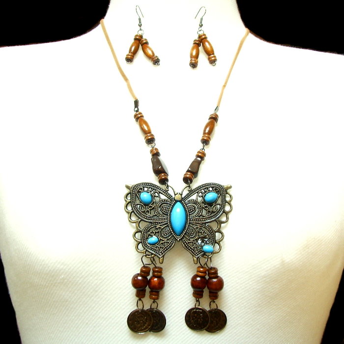 Necklace with pearls, butterfly pendant and earrings